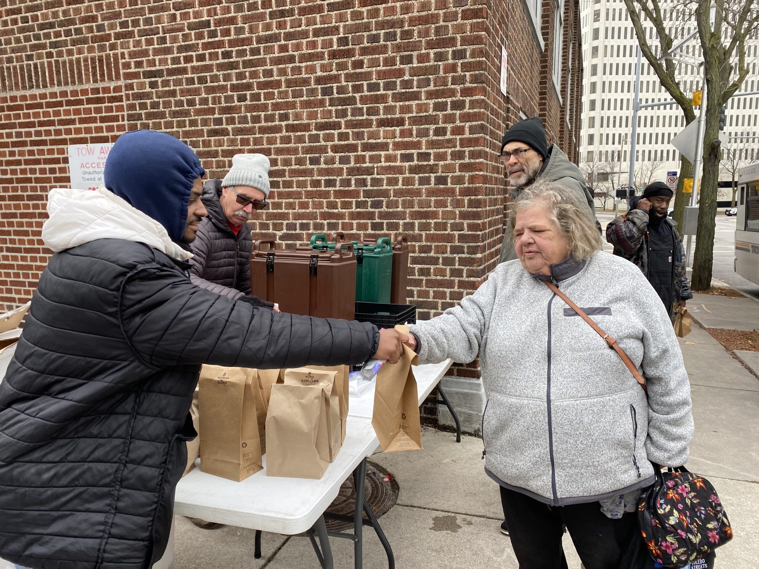 Food For Thought volunteers distributing food downtown
